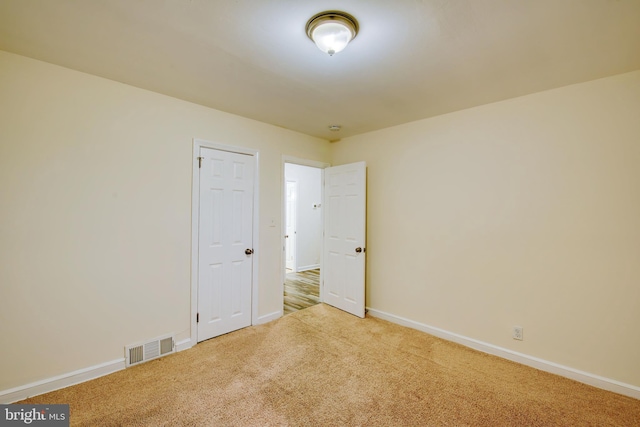 empty room featuring carpet floors