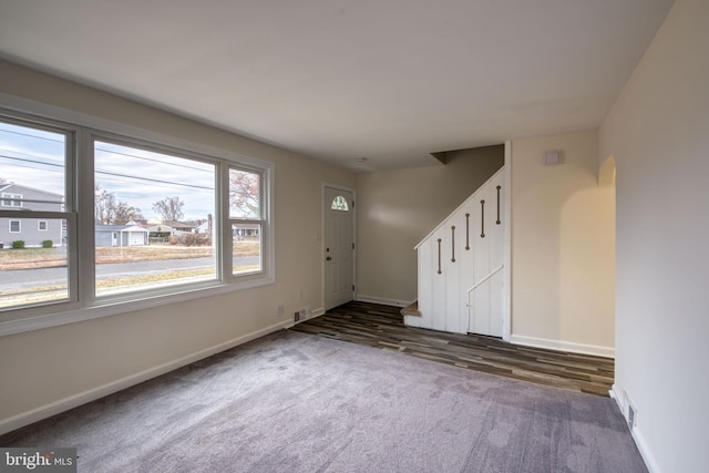 entrance foyer featuring dark wood-type flooring