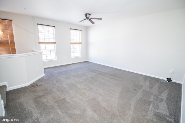 carpeted empty room with ceiling fan