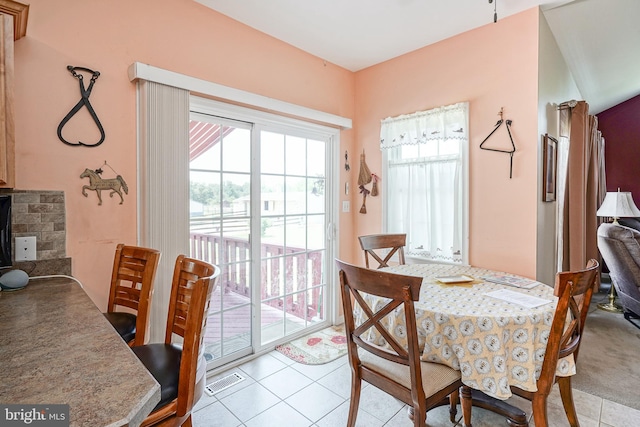 dining area featuring light tile patterned floors