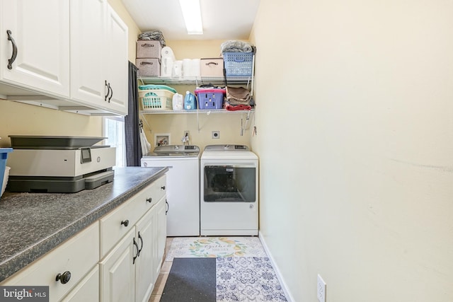 clothes washing area with washing machine and clothes dryer