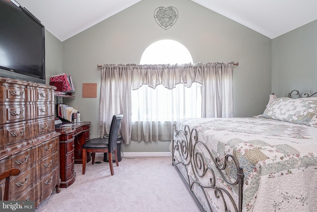 carpeted bedroom with vaulted ceiling