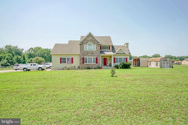 view of front of home featuring a shed and a front yard