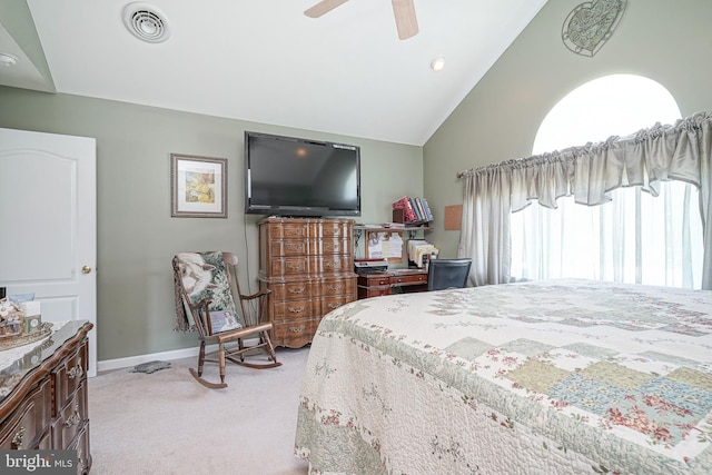 bedroom with ceiling fan, light colored carpet, and lofted ceiling