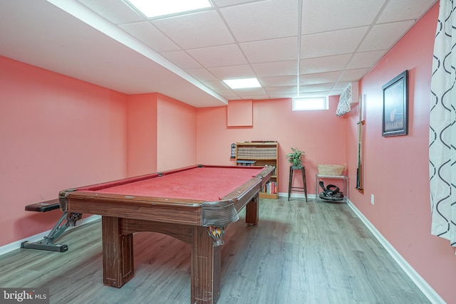 playroom with wood-type flooring, a paneled ceiling, and pool table