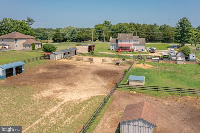 birds eye view of property featuring a rural view