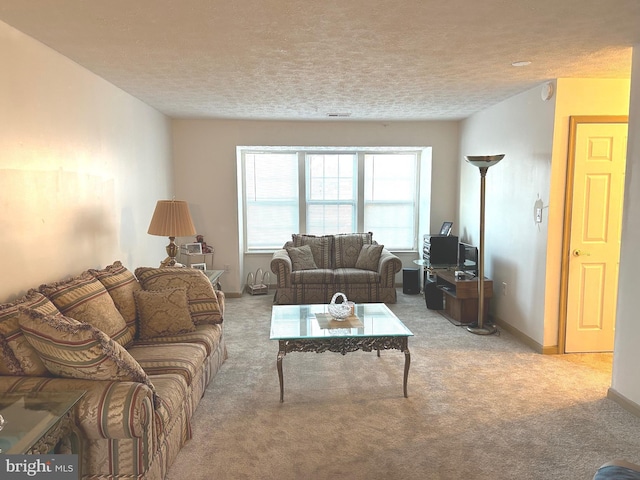 living room with light carpet and a textured ceiling