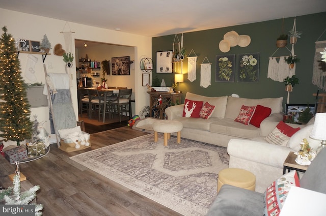 living room with a chandelier and wood-type flooring