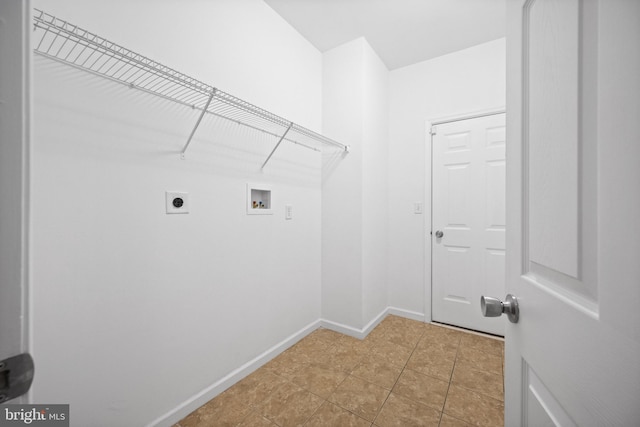 laundry area with electric dryer hookup, hookup for a washing machine, and light tile patterned flooring