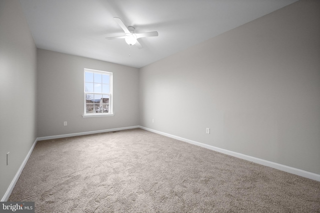 unfurnished room with carpet floors and ceiling fan