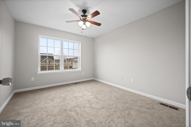 carpeted empty room with ceiling fan