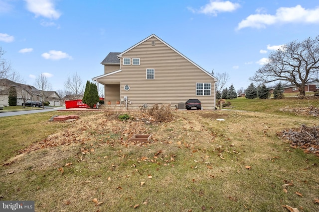 view of property exterior featuring a lawn