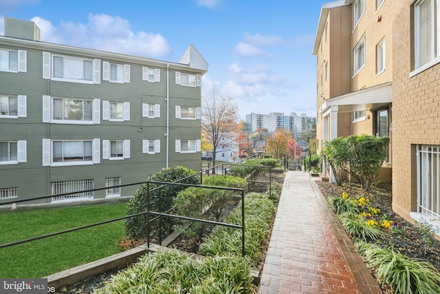 view of home's community featuring a lawn