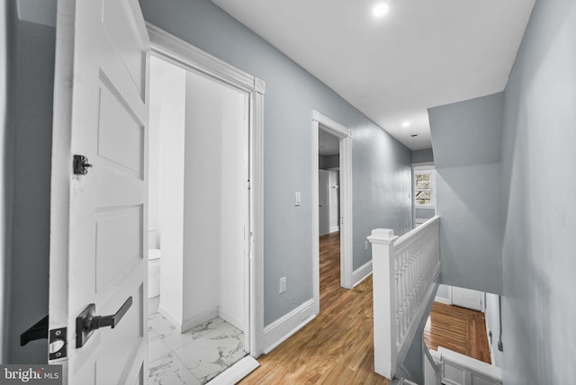 corridor featuring light hardwood / wood-style floors