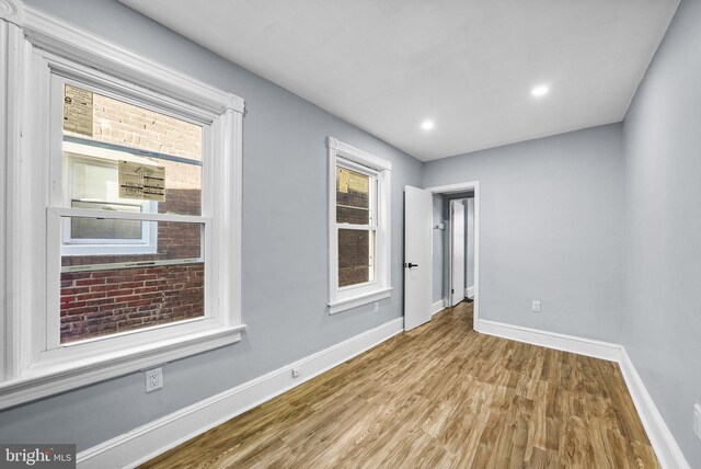 spare room featuring light hardwood / wood-style floors