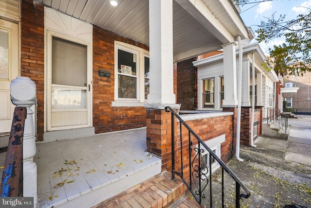 view of exterior entry with covered porch