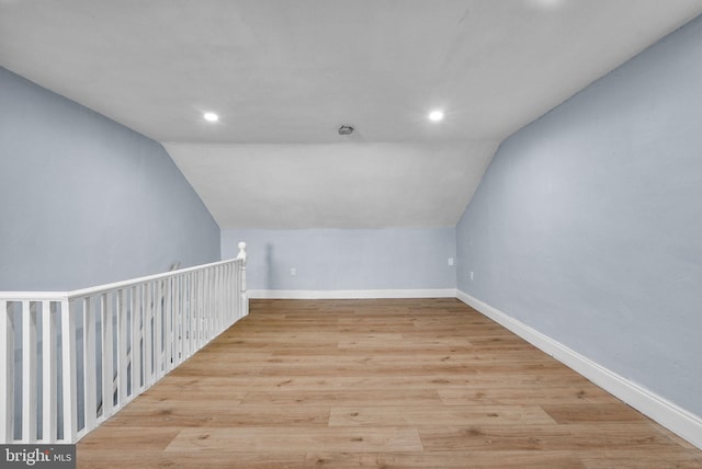 bonus room featuring light hardwood / wood-style floors and lofted ceiling