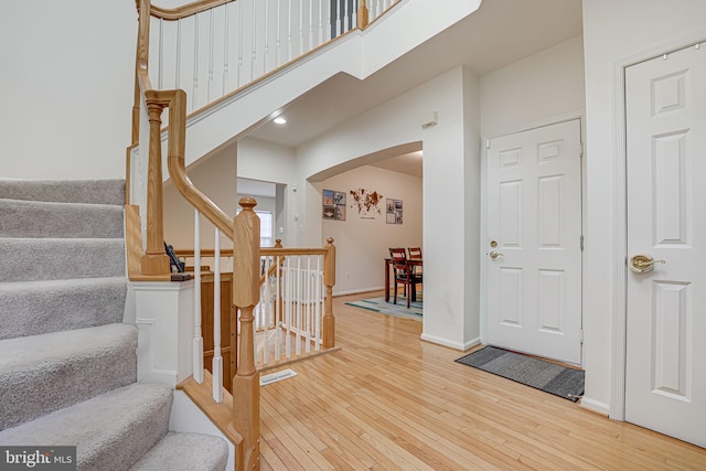 stairway featuring wood-type flooring