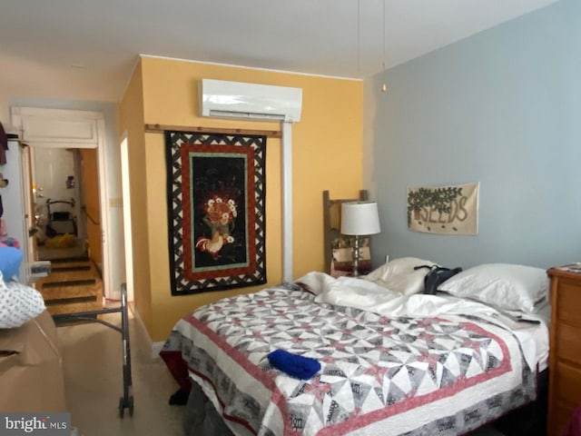 bedroom with an AC wall unit