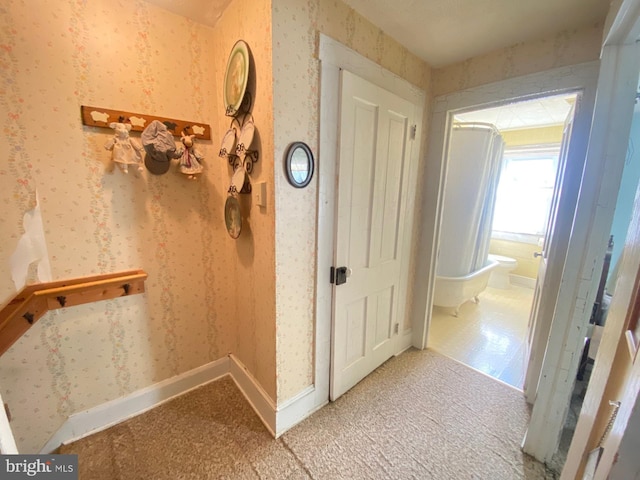 corridor featuring light tile patterned floors