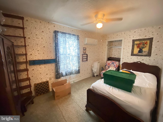 bedroom with an AC wall unit and ceiling fan