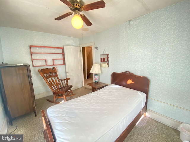 bedroom with light colored carpet and ceiling fan