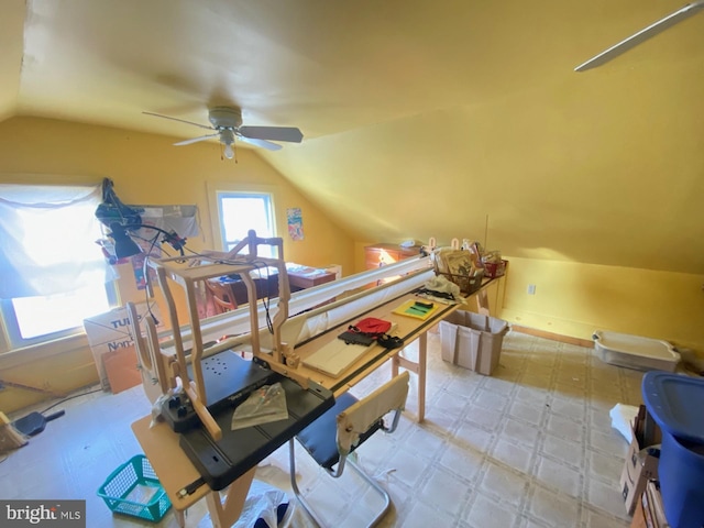 interior space featuring ceiling fan and vaulted ceiling