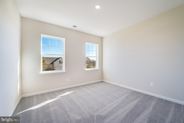 spare room featuring carpet flooring