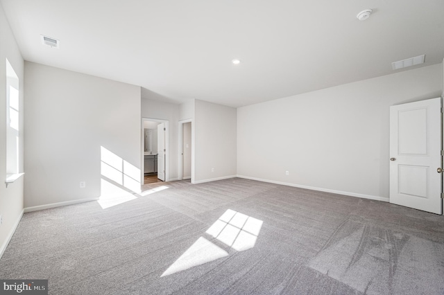 empty room with light colored carpet