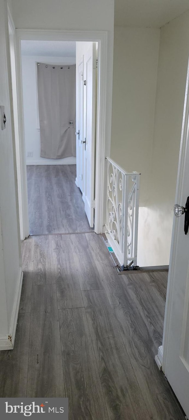 hallway with wood finished floors