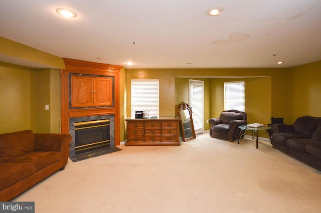 carpeted living room with a fireplace