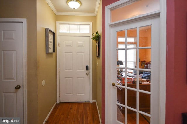 doorway to outside featuring dark hardwood / wood-style floors and ornamental molding