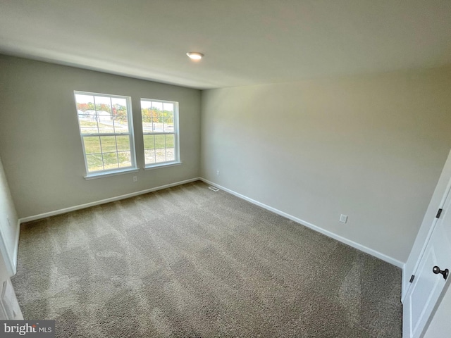 empty room with carpet flooring