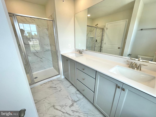 bathroom with vanity, toilet, and an enclosed shower