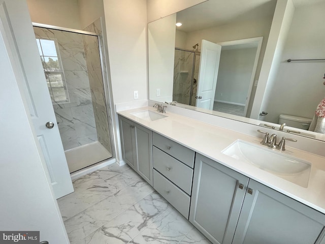 bathroom featuring toilet, vanity, and walk in shower