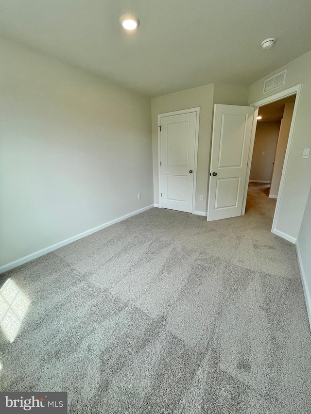 unfurnished bedroom with carpet floors