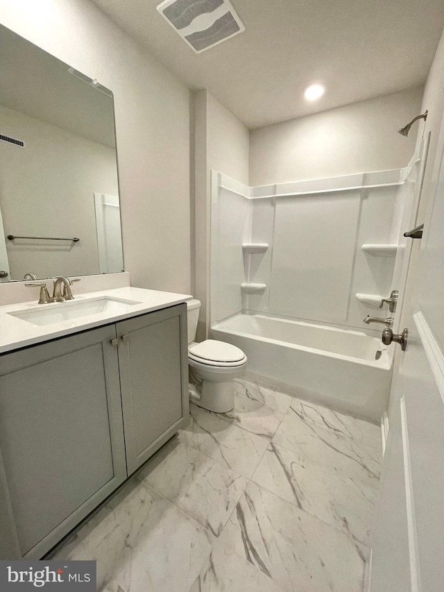 full bathroom with vanity, toilet, and washtub / shower combination