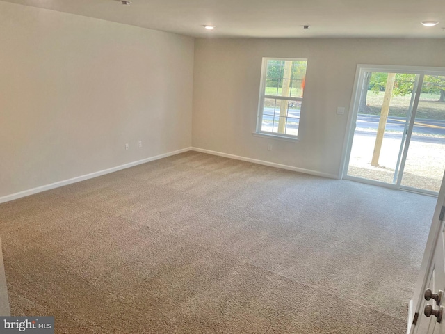 unfurnished room featuring carpet flooring