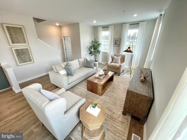 living room with light hardwood / wood-style floors