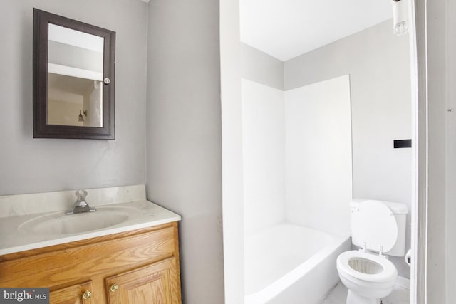 bathroom featuring tile patterned floors, vanity, and toilet