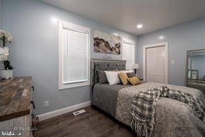 bedroom featuring dark wood-type flooring