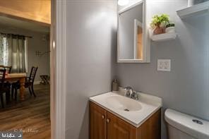 bathroom with toilet and vanity