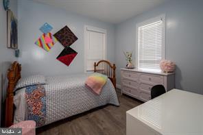 bedroom featuring dark hardwood / wood-style flooring