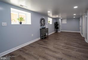 basement featuring dark wood-type flooring