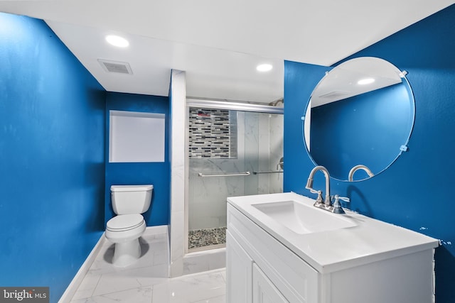 bathroom with a shower with shower door, toilet, and vanity