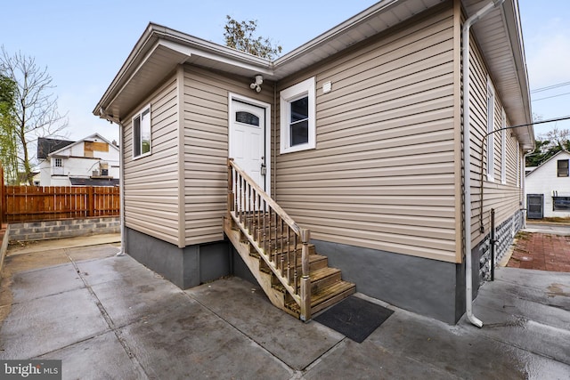 entrance to property featuring a patio area