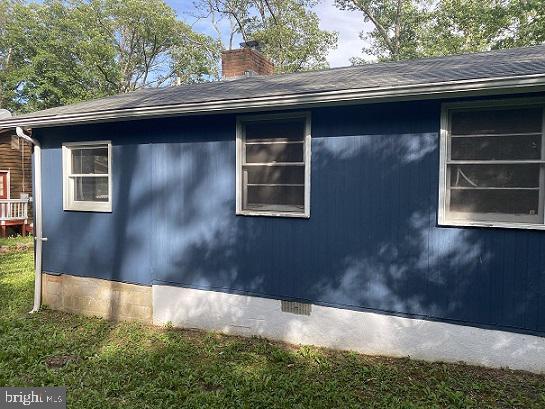 view of home's exterior featuring a yard