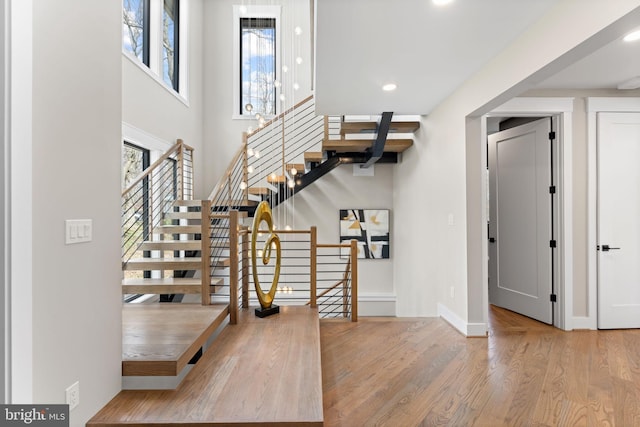 3113 Circle Hill Rd, Alexandria, VA 22305 - entryway with wood finished floors, baseboards, stairs, recessed lighting, and a high ceiling