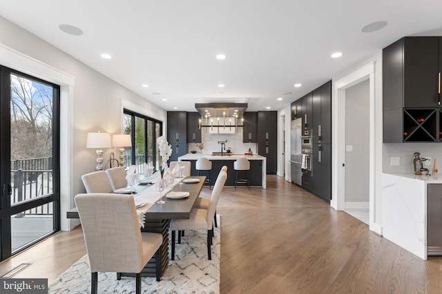 3113 Circle Hill Rd, Alexandria, VA 22305 - dining area featuring a chandelier, light wood finished floors, and recessed lighting