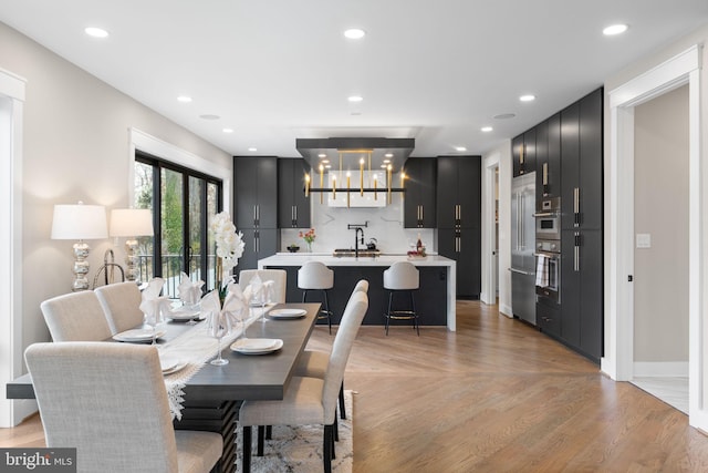3113 Circle Hill Rd, Alexandria, VA 22305 - dining area with light wood-style flooring, recessed lighting, and a chandelier